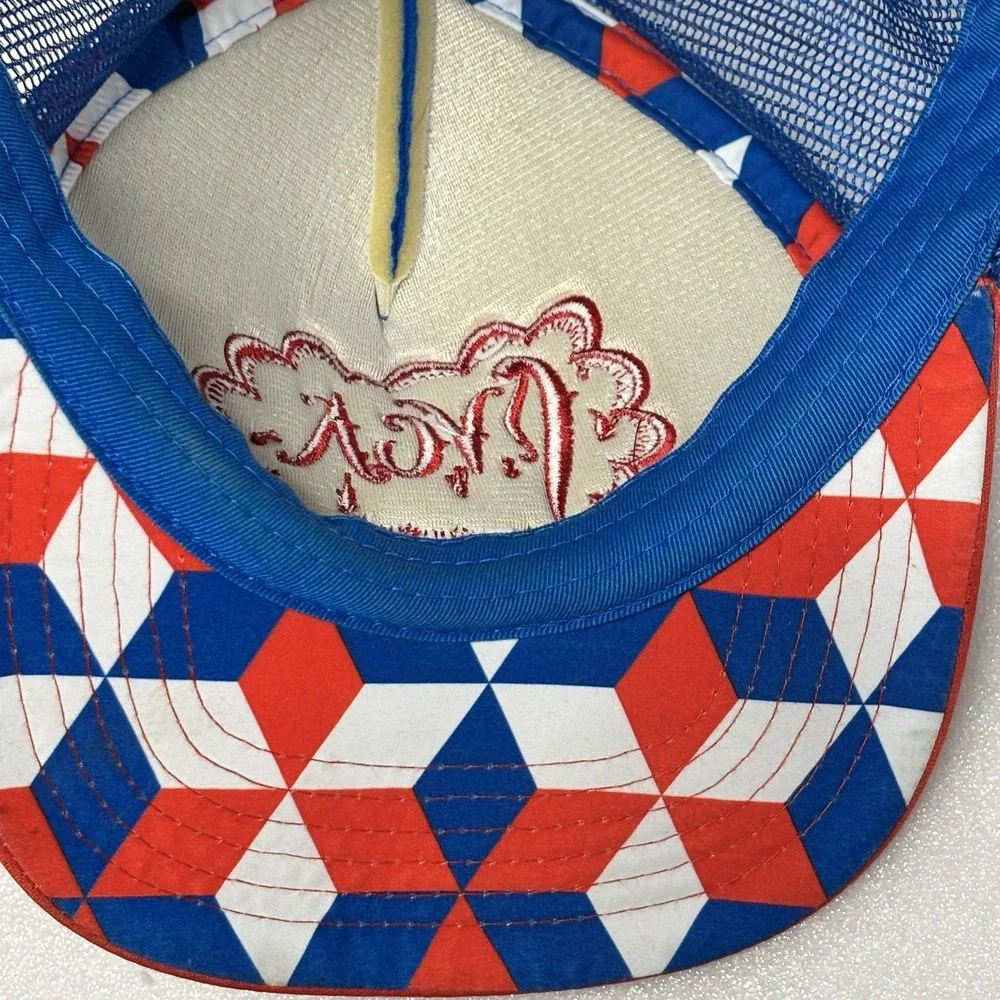 RVCA foam trucker hat featuring a blue crown, red brim, and red mesh back